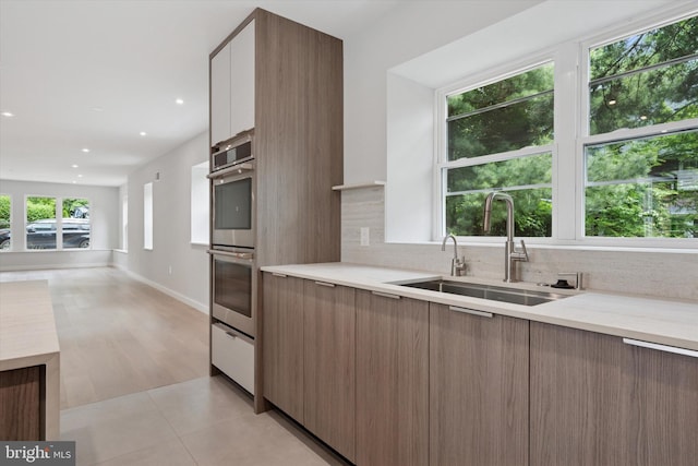 160 Union Ave, Bala Cynwyd, PA 19004 - kitchen with modern cabinets, a sink, double oven, tasteful backsplash, and recessed lighting