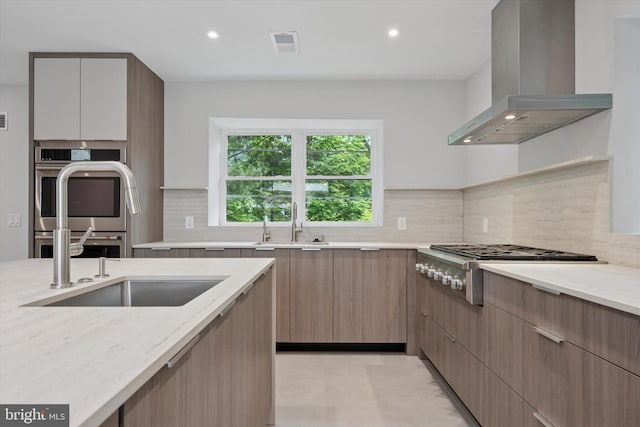 160 Union Ave, Bala Cynwyd, PA 19004 - kitchen with wall chimney exhaust hood, light stone countertops, modern cabinets, and recessed lighting