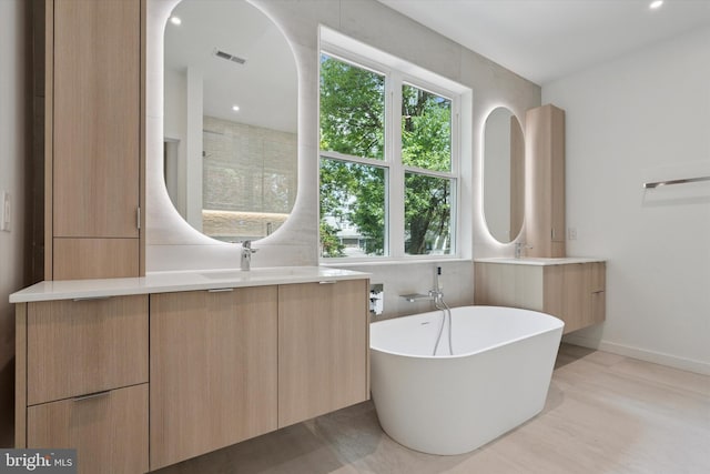 160 Union Ave, Bala Cynwyd, PA 19004 - full bathroom featuring vanity, a freestanding bath, baseboards, and recessed lighting