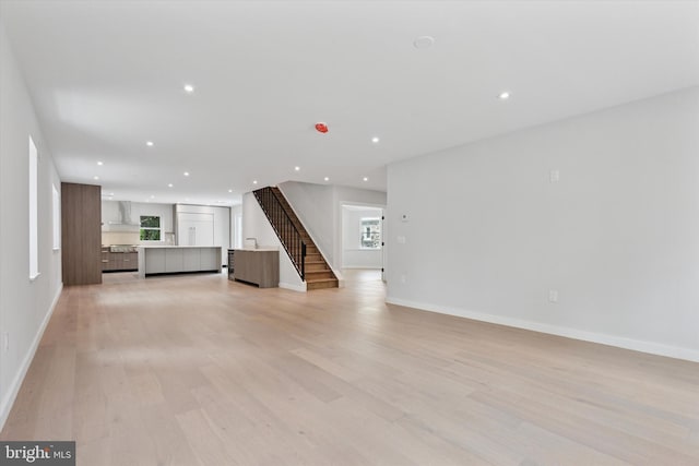 160 Union Ave, Bala Cynwyd, PA 19004 - unfurnished living room featuring recessed lighting, stairway, light wood-style floors, and baseboards