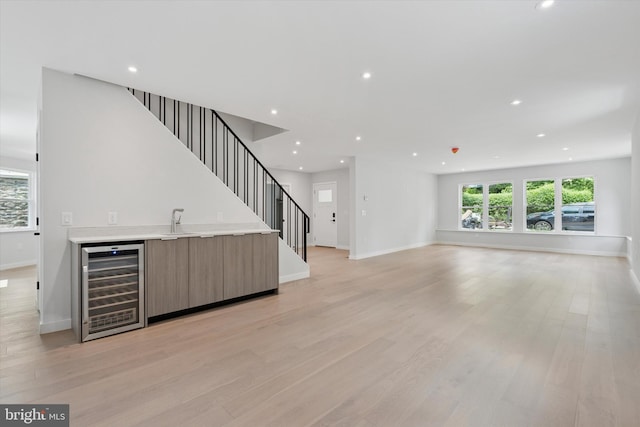 160 Union Ave, Bala Cynwyd, PA 19004 - unfurnished living room featuring wine cooler, wet bar, recessed lighting, stairway, and baseboards