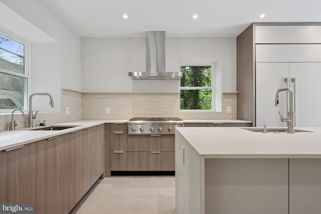 160 Union Ave, Bala Cynwyd, PA 19004 - kitchen with modern cabinets, wall chimney range hood, a sink, light countertops, and recessed lighting