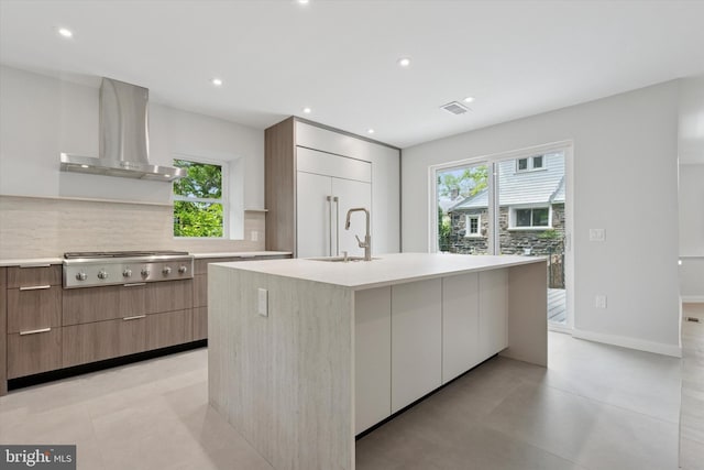 160 Union Ave, Bala Cynwyd, PA 19004 - kitchen featuring modern cabinets, wall chimney range hood, stainless steel gas stovetop, a sink, and backsplash