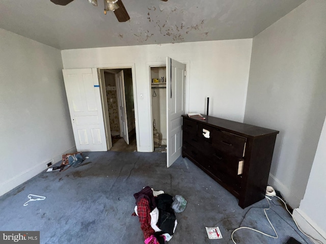 unfurnished bedroom featuring baseboards, ceiling fan, and carpet