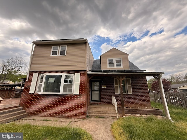 4703 Fayette Dr, Bristol, PA 19007 - view of front of house with brick siding, roof with shingles, and covered porch