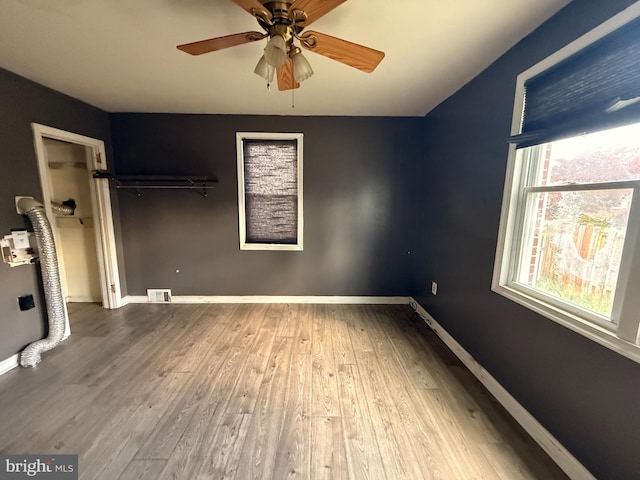 4703 Fayette Dr, Bristol, PA 19007 - unfurnished bedroom with wood finished floors, a closet, baseboards, vaulted ceiling, and ceiling fan