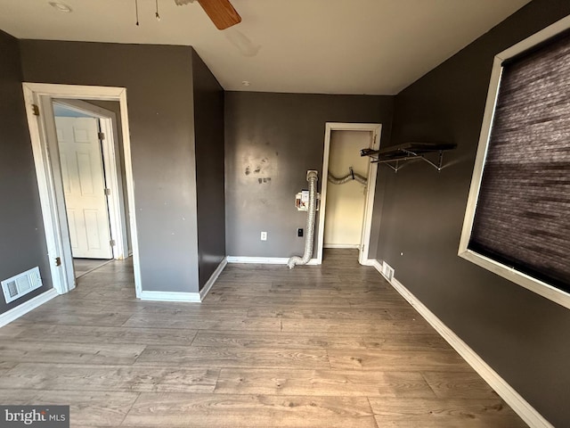 4703 Fayette Dr, Bristol, PA 19007 - unfurnished bedroom with wood finished floors, baseboards, and a ceiling fan