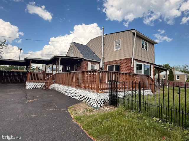 4703 Fayette Dr, Bristol, PA 19007 - back of house with a wooden deck and brick siding