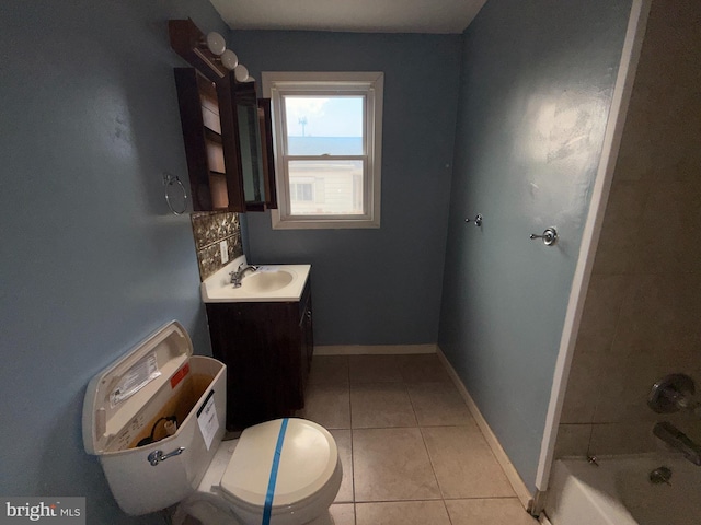 4703 Fayette Dr, Bristol, PA 19007 - full bathroom featuring toilet, vanity, tile patterned flooring, baseboards, and shower / bath combination
