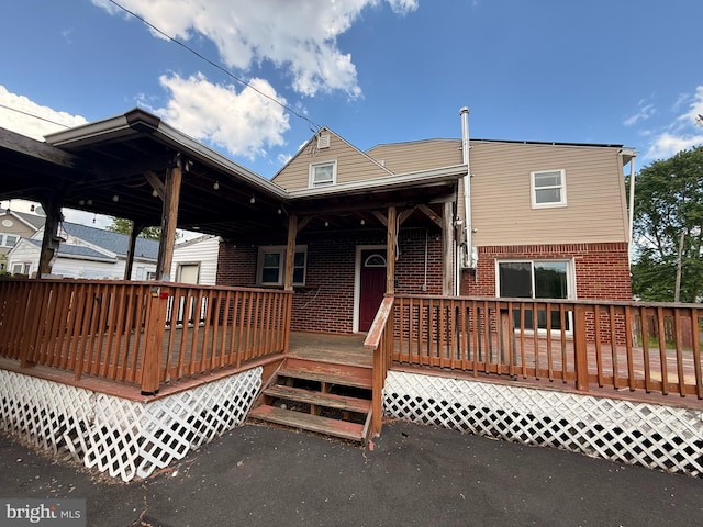4703 Fayette Dr, Bristol, PA 19007 - rear view of property with brick siding and a deck