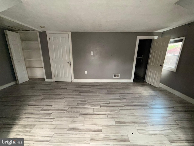 4703 Fayette Dr, Bristol, PA 19007 - unfurnished bedroom featuring baseboards, wood finished floors, and a closet
