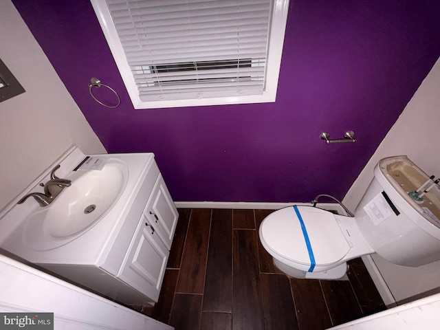4703 Fayette Dr, Bristol, PA 19007 - bathroom featuring vanity, toilet, wood finished floors, and baseboards