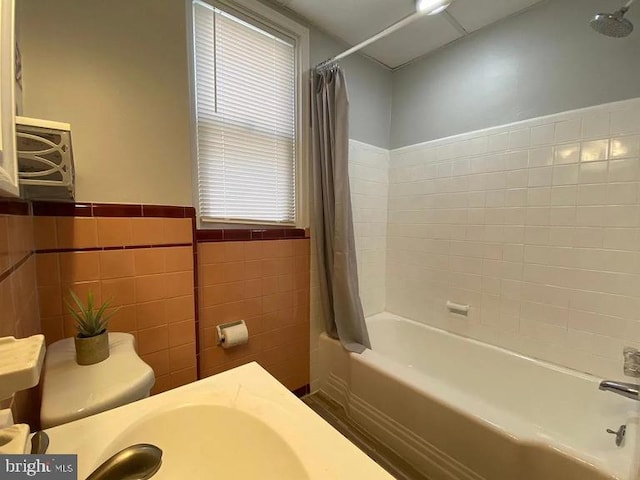 6631 Erdrick St, Philadelphia, PA 19135 - full bath with shower / bathtub combination with curtain, vanity, tile walls, wainscoting, and toilet