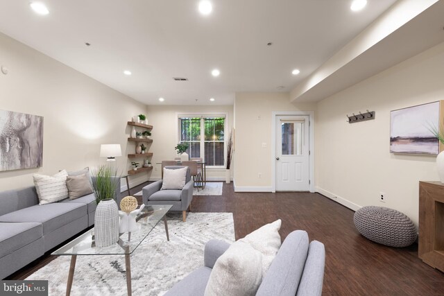 living room with wood finished floors, recessed lighting, and baseboards