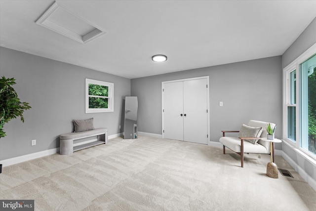 7606 Millrace Rd, Capitol Heights, MD 20743 - living area featuring attic access, carpet floors, and baseboards