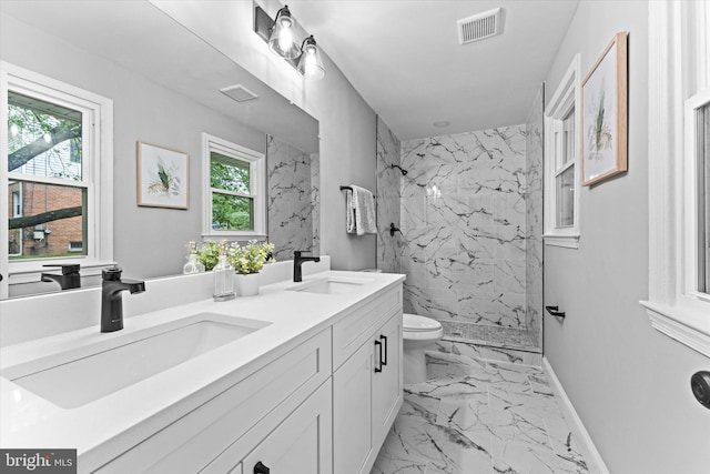 7606 Millrace Rd, Capitol Heights, MD 20743 - full bath with toilet, marble look tile flooring, a marble finish shower, double vanity, and baseboards