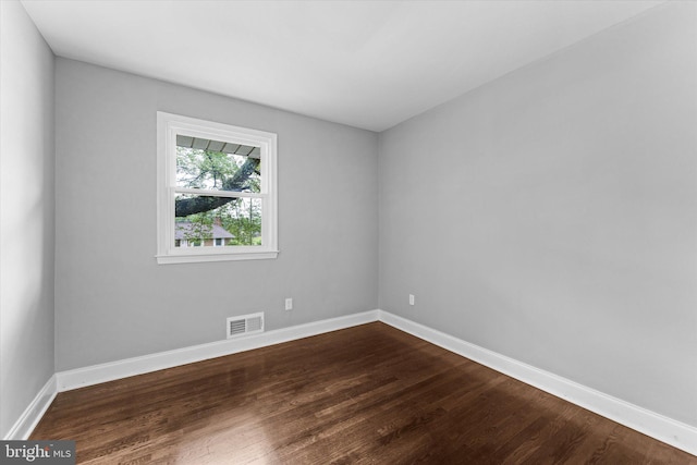 7606 Millrace Rd, Capitol Heights, MD 20743 - spare room with dark wood-style flooring and baseboards