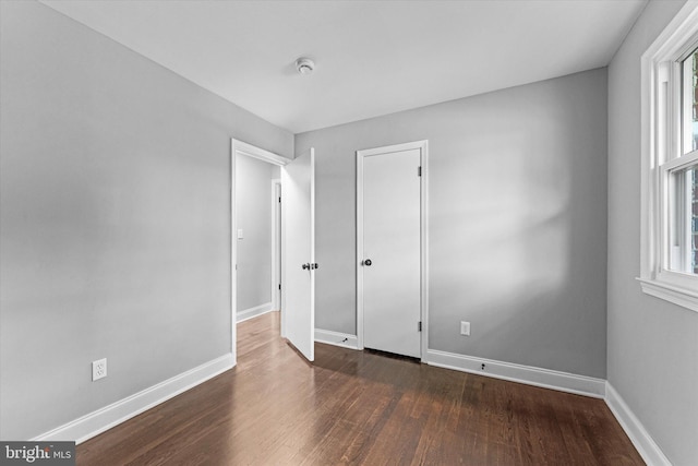 7606 Millrace Rd, Capitol Heights, MD 20743 - unfurnished bedroom featuring wood finished floors and baseboards