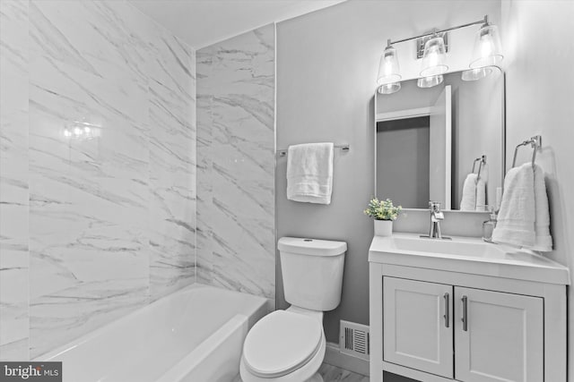 7606 Millrace Rd, Capitol Heights, MD 20743 - bathroom featuring marble look tiles, vanity, toilet, bathtub / shower combination, and baseboards