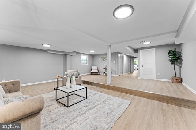 7606 Millrace Rd, Capitol Heights, MD 20743 - living area with wood finished floors and baseboards