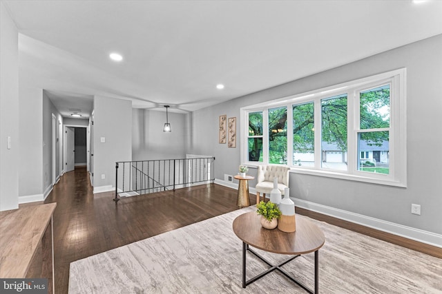 7606 Millrace Rd, Capitol Heights, MD 20743 - living area featuring an upstairs landing, wood finished floors, plenty of natural light, recessed lighting, and baseboards