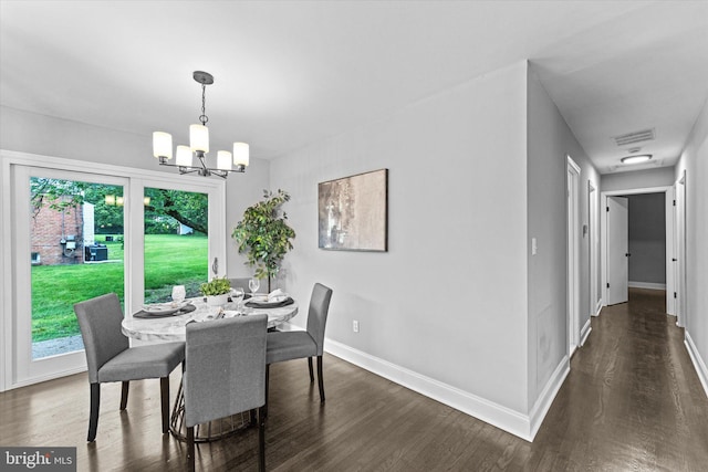 7606 Millrace Rd, Capitol Heights, MD 20743 - dining space with a chandelier, baseboards, and dark wood-style floors