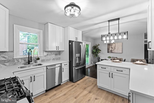 7606 Millrace Rd, Capitol Heights, MD 20743 - kitchen with stainless steel appliances, a sink, light countertops, and tasteful backsplash