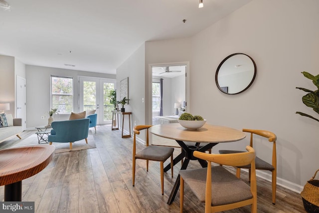 1201 E E W Hwy Unit 208, Silver Spring, MD 20910 - dining room with baseboards and light wood-type flooring