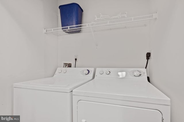 1201 E E W Hwy Unit 208, Silver Spring, MD 20910 - laundry room with separate washer and dryer