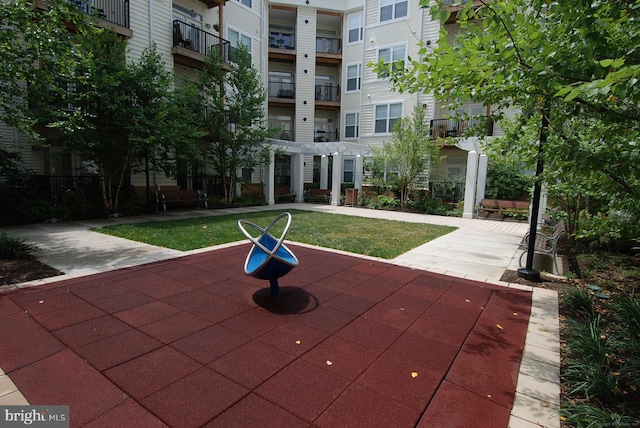 1201 E E W Hwy Unit 208, Silver Spring, MD 20910 - view of home's community featuring a pergola