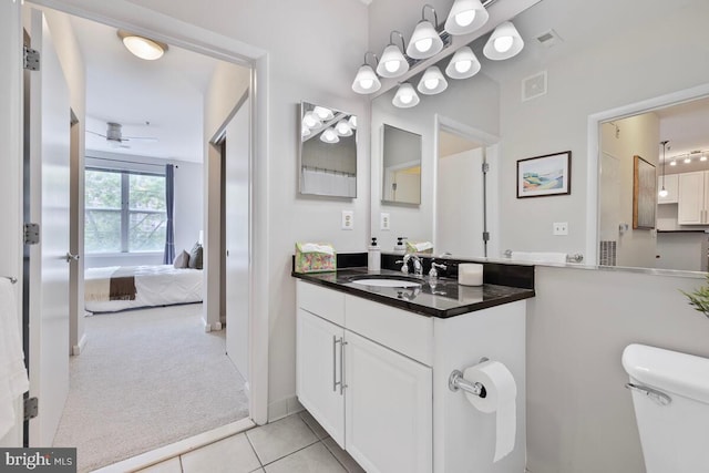 1201 E E W Hwy Unit 208, Silver Spring, MD 20910 - bathroom with vanity, connected bathroom, tile patterned flooring, toilet, and a ceiling fan