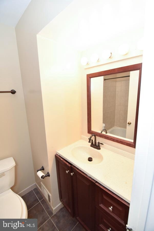 3171 Chester Grove Rd, Upper Marlboro, MD 20774 - bathroom featuring toilet, tile patterned floors, vanity, and baseboards