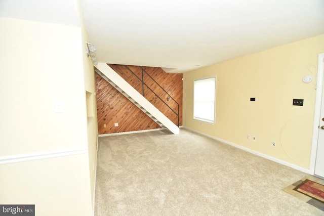 3171 Chester Grove Rd, Upper Marlboro, MD 20774 - basement with wooden walls, carpet flooring, baseboards, and an accent wall