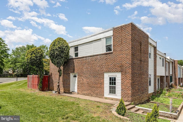 rear view of property featuring brick siding