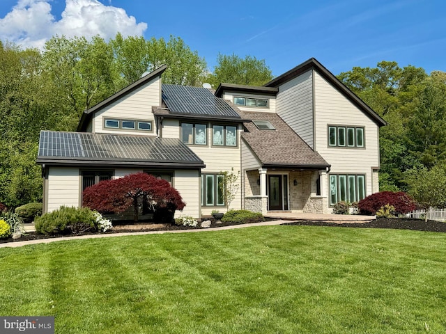 view of front of property with a front lawn and stone siding