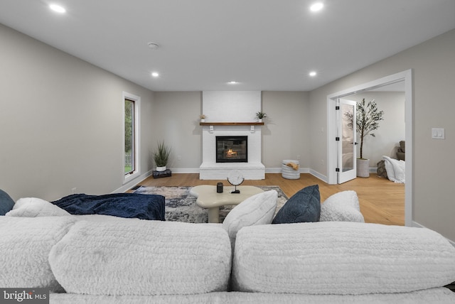 18 Haskel Dr, West Windsor, NJ 08550 - living room featuring recessed lighting, wood finished floors, and a glass covered fireplace
