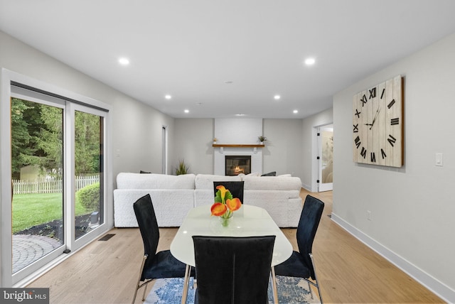18 Haskel Dr, West Windsor, NJ 08550 - dining area featuring recessed lighting, light wood-type flooring, and a glass covered fireplace