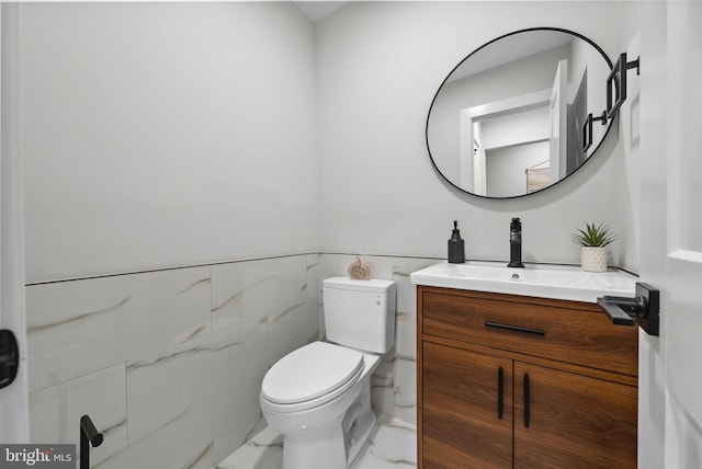 18 Haskel Dr, West Windsor, NJ 08550 - bathroom with marble finish floors, vanity, wainscoting, and tile walls