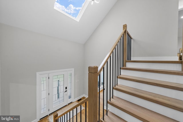 18 Haskel Dr, West Windsor, NJ 08550 - stairway featuring high vaulted ceiling, wood finished floors, a skylight, and healthy amount of natural light