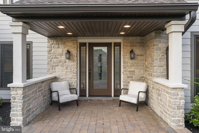 18 Haskel Dr, West Windsor, NJ 08550 - entrance to property with a shingled roof, covered porch, and stone siding