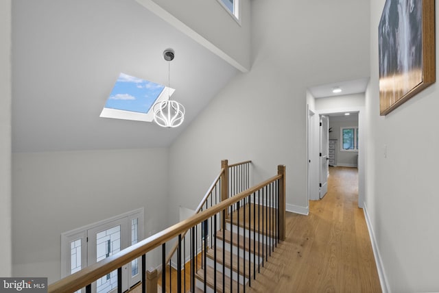 18 Haskel Dr, West Windsor, NJ 08550 - hallway featuring a high ceiling, an upstairs landing, wood finished floors, plenty of natural light, and a skylight