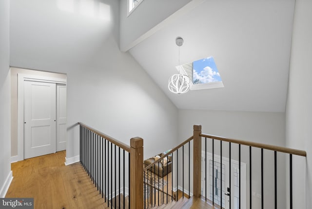 18 Haskel Dr, West Windsor, NJ 08550 - stairs featuring wood finished floors, a skylight, and high vaulted ceiling