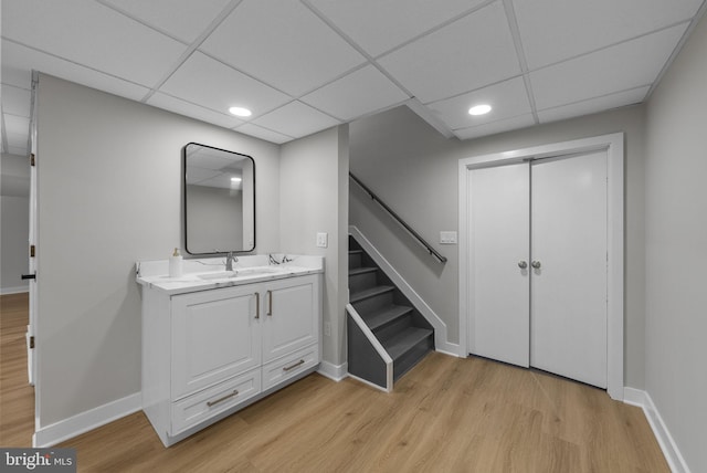 18 Haskel Dr, West Windsor, NJ 08550 - bathroom featuring wood finished floors, vanity, recessed lighting, and a drop ceiling