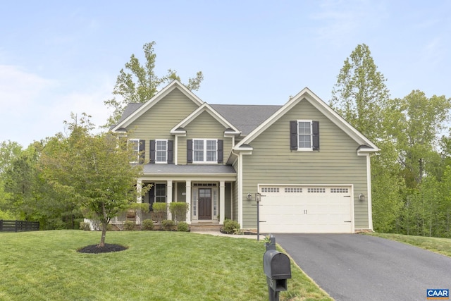 125 Highland Cir, Zion Crossroads, VA 22942 - view of front of home with a porch, aphalt driveway, an attached garage, and a front lawn