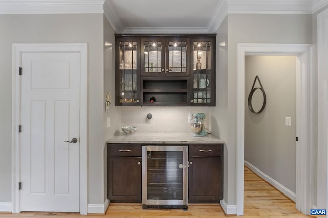 125 Highland Cir, Zion Crossroads, VA 22942 - bar with a dry bar, beverage cooler, ornamental molding, light wood finished floors, and tasteful backsplash