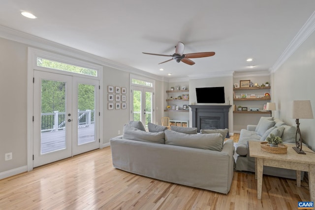 125 Highland Cir, Zion Crossroads, VA 22942 - living room featuring french doors, light wood-style flooring, ornamental molding, a glass covered fireplace, and ceiling fan