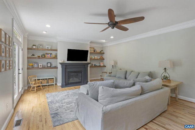 125 Highland Cir, Zion Crossroads, VA 22942 - living room with a ceiling fan, visible vents, a glass covered fireplace, light wood-style floors, and ornamental molding