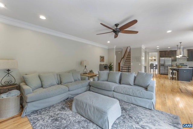 125 Highland Cir, Zion Crossroads, VA 22942 - living area featuring crown molding, light wood-style flooring, stairs, and ceiling fan