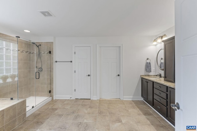 125 Highland Cir, Zion Crossroads, VA 22942 - bathroom featuring a stall shower, double vanity, baseboards, and visible vents