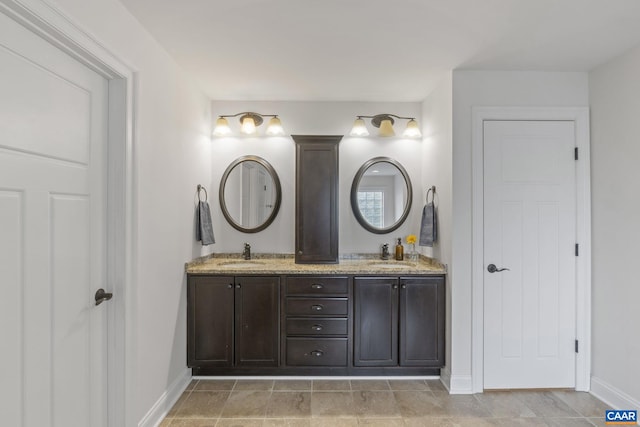 125 Highland Cir, Zion Crossroads, VA 22942 - full bath featuring a sink, double vanity, and baseboards
